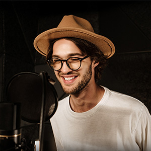 handsome-smiling-male-singer-happily-singing-recor-TT48JH8ss.jpg